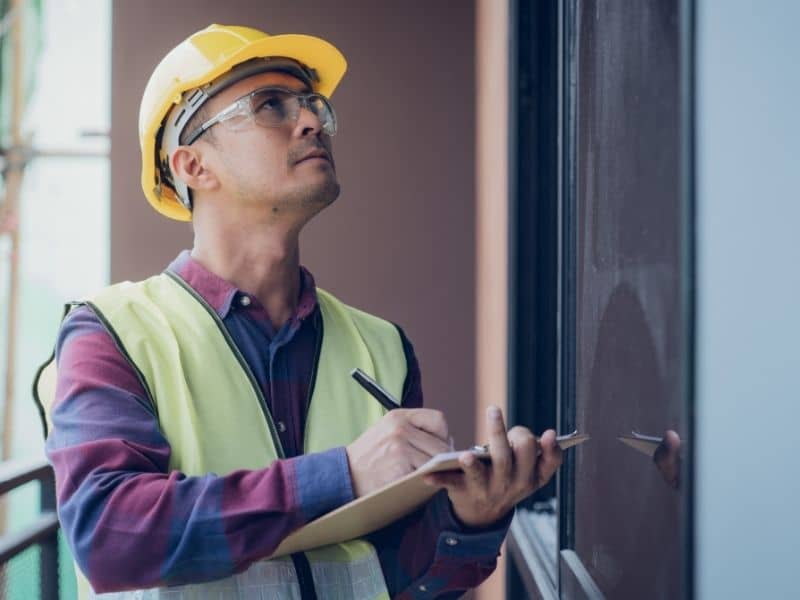 Professional inspecting an industrial commercial property before purchase as part of the due diligence process prior to an ALTA Survey.