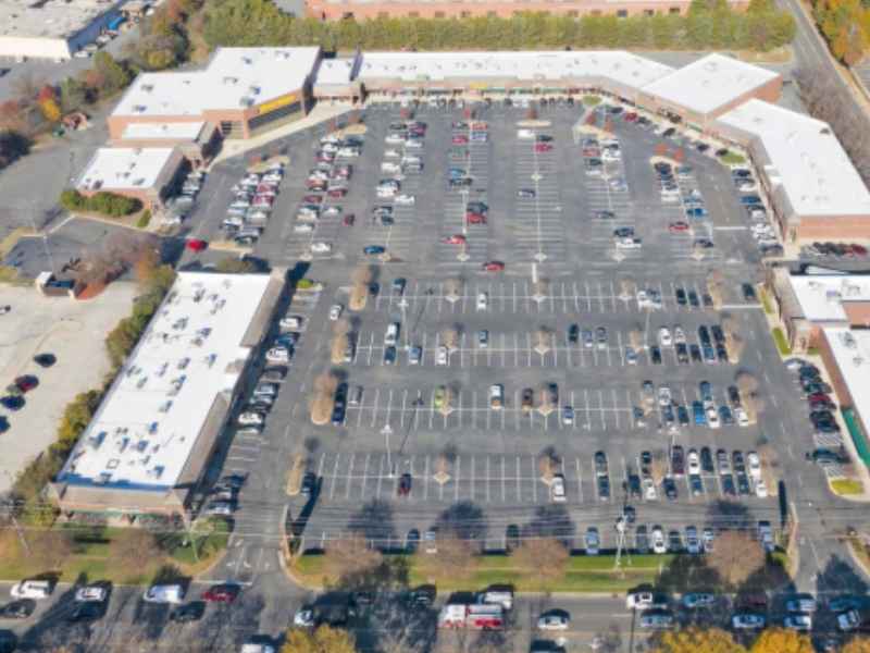 Aerial view of a multi-tenant commercial property with shared parking and access areas for an ALTA land survey in Toledo Ohio.